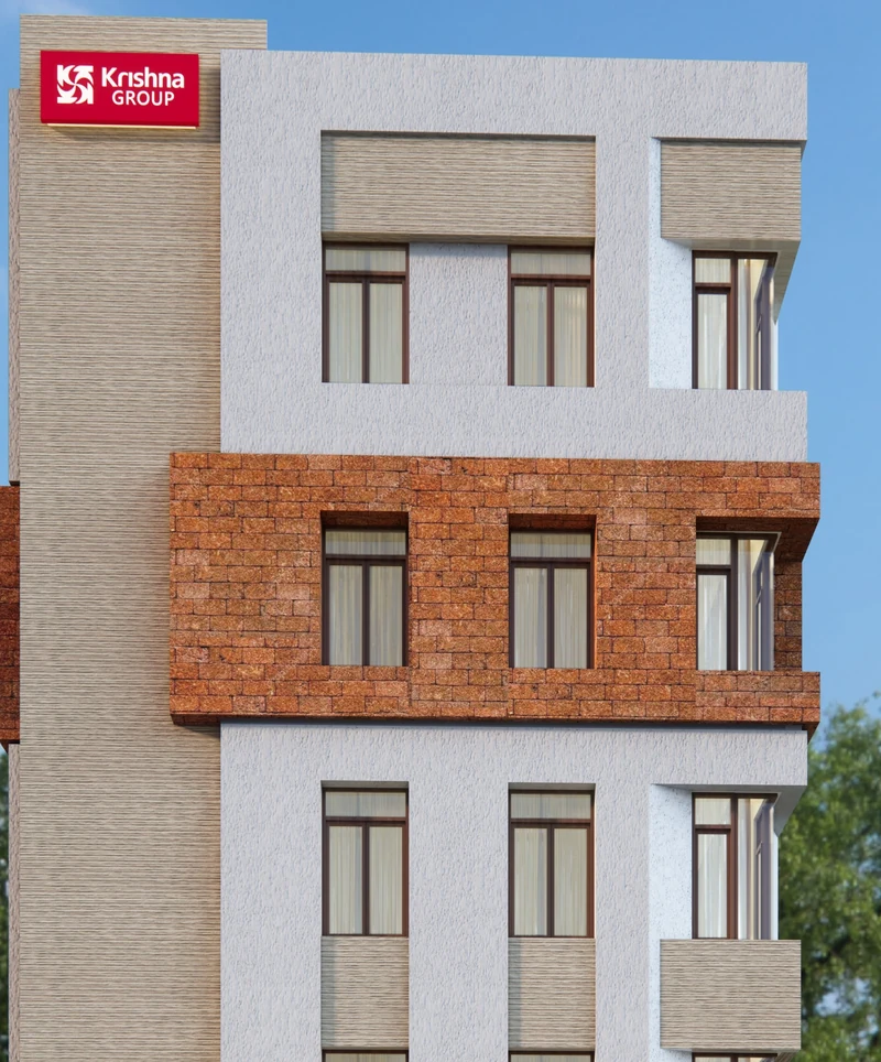 Detail of the Unnatii façade showing the terracotta band and window grid